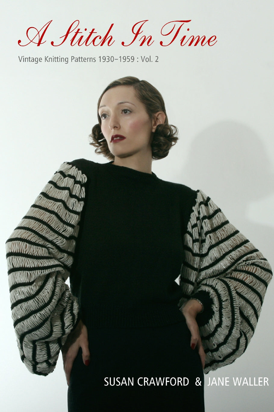 A picture of the cover of "A Stitch in Time: Vintage Knitting Patterns 1930-1959: Vol. 2" by Susan Crawford and Jane Waller. The cover picture is a woman standing, hands on hips, with vintage styled hair and make up. She wears a black knit jumper with very big floppy sleeves, striped in black and white.